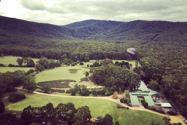 Aerial image of Cave Hill Creek camp and surrounds from a hot air balloon in the sky