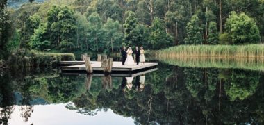 Wedding couple standing at Cave Hill Creek waterfront
