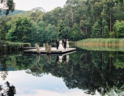 Wedding couple standing at Cave Hill Creek waterfront