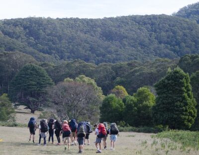 Group of people wearing overnight hiking backpacks doing the Beeripmo walk